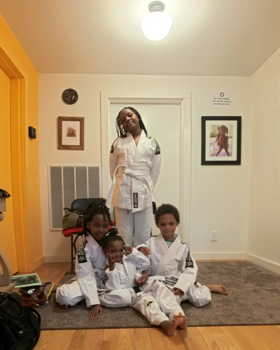Kids in gis standing calmly during onboarding at Sensei Sandy BJJ in Tannersville