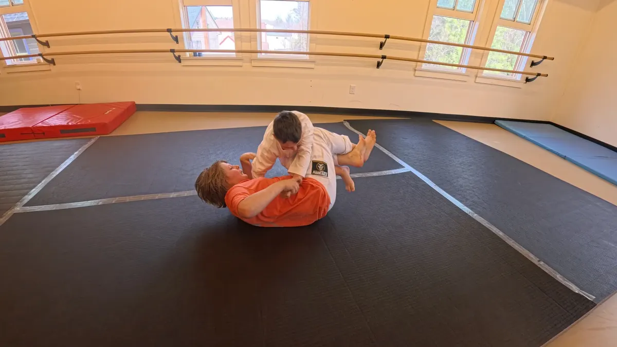 Child practicing a calm first-class movement on the mats at Sensei Sandy BJJ in Tannersville