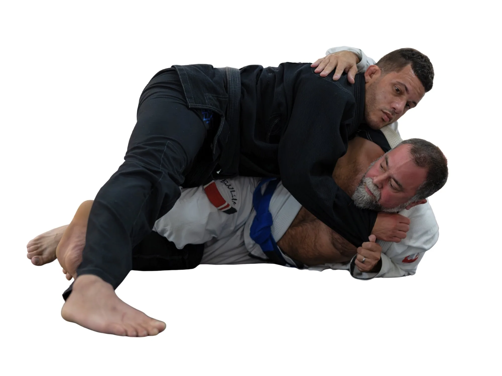 Jiu-Jitsu instructor demonstrating tight side control during a private training session.