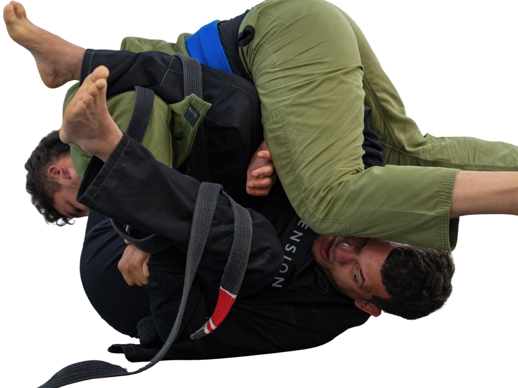 Advanced Brazilian Jiu-Jitsu students working through an inverted leg entanglement.
