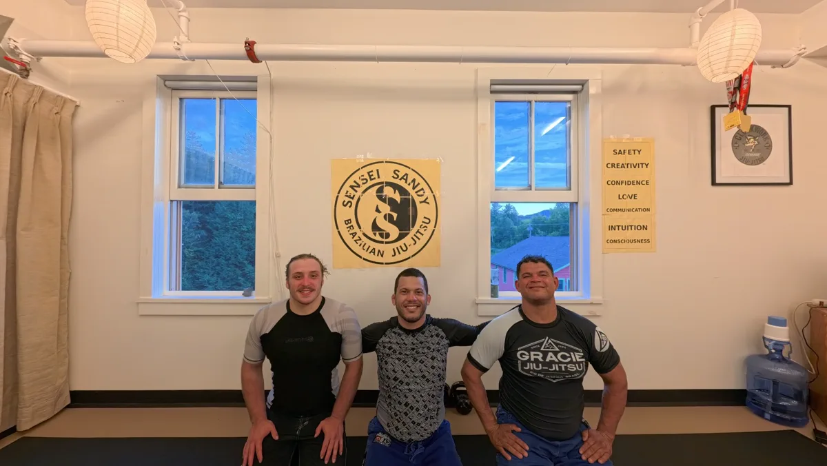 Sensei Sandy and adult students smiling after a calm training session in Tannersville