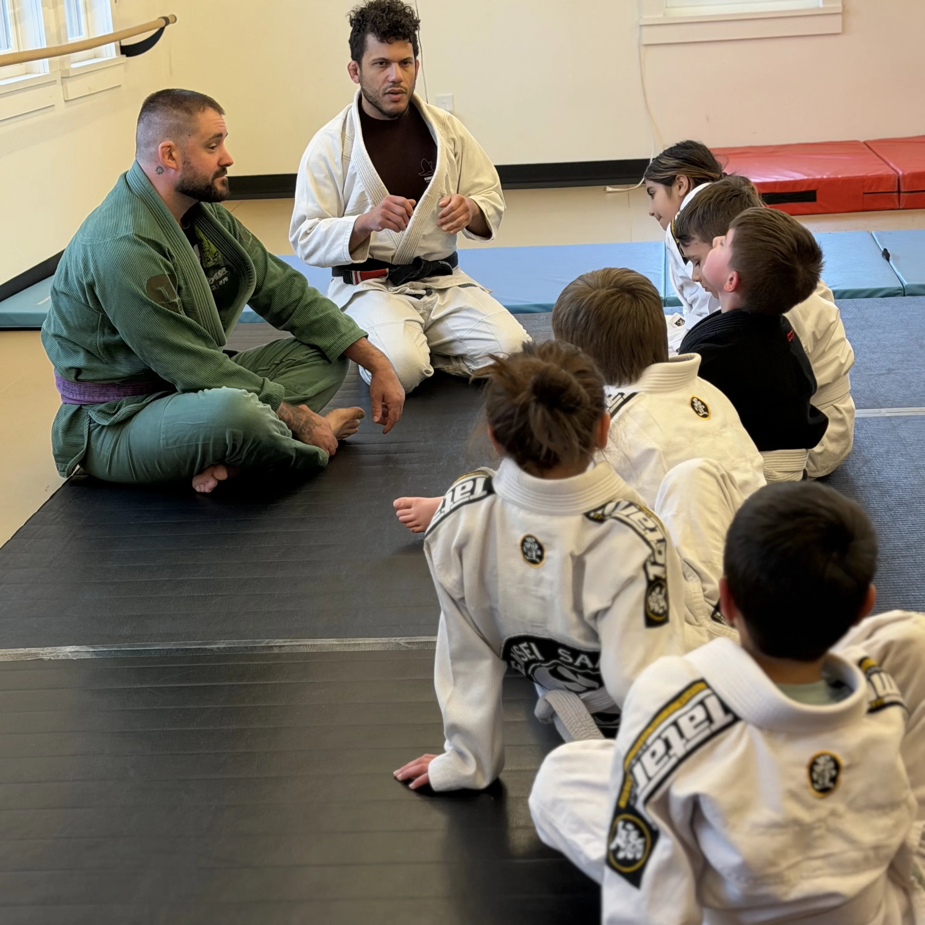 Kids Jiu Jitsu Coach helping students