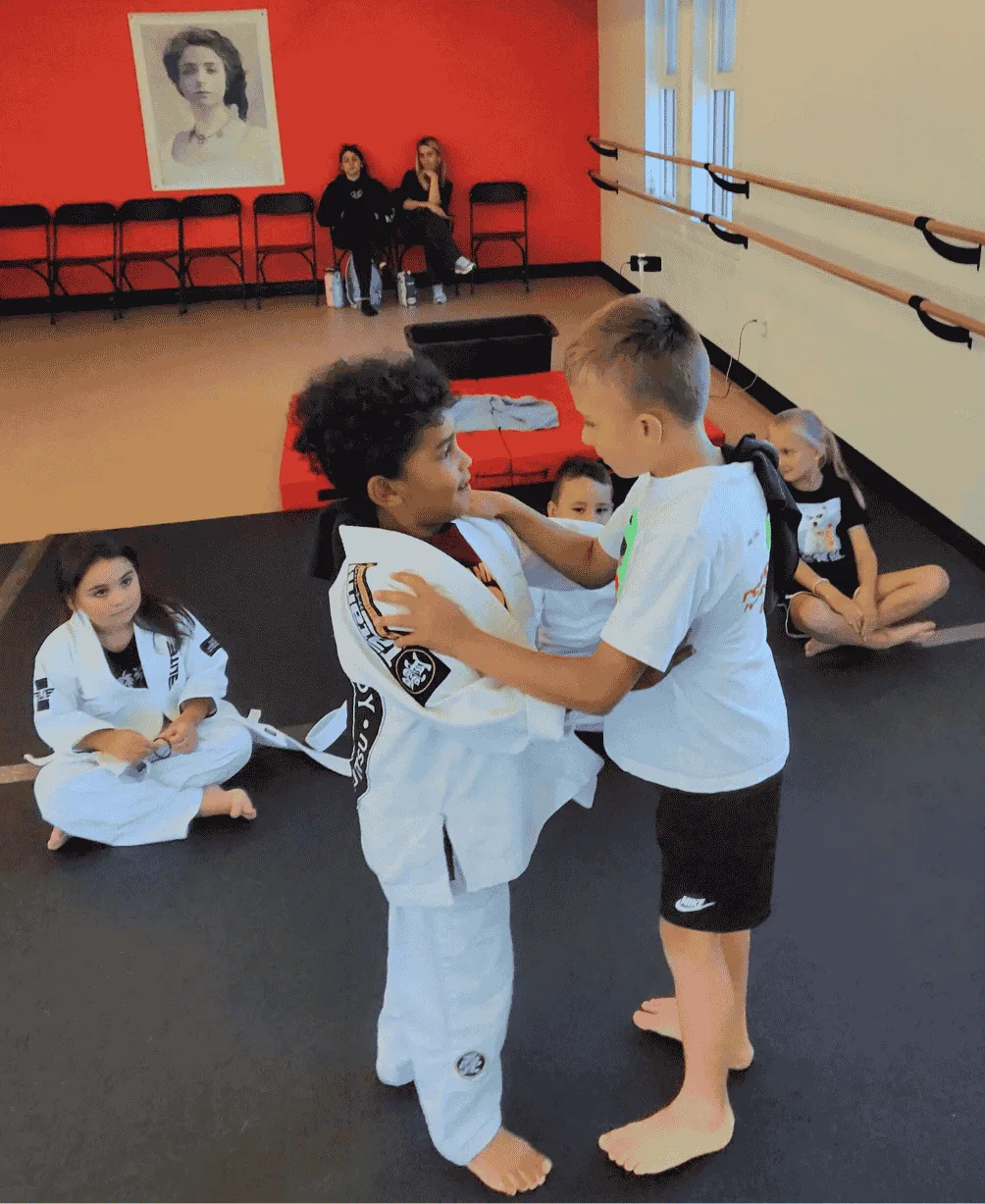 Kids practicing calm, supervised jiu-jitsu